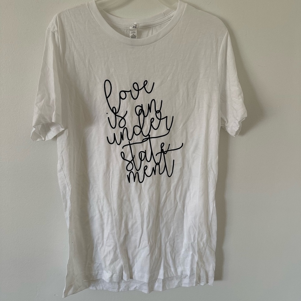 White T-Shirt with graphic “live is an understatement” nwot